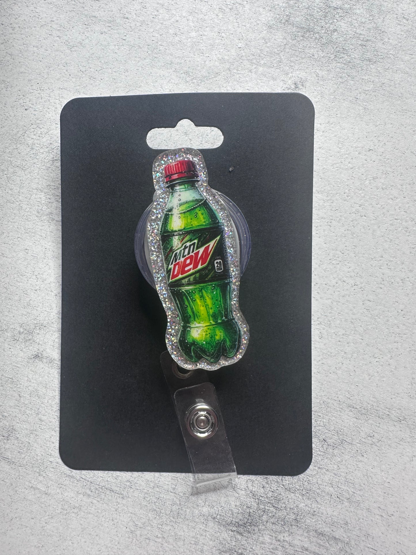 Mtn Dew badge reel